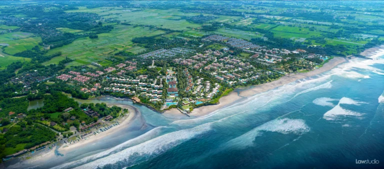 Aerial view of Ciputra Beach Resort, 80-hectare luxury residential development, Bali coastline, Tabanan, beachfront property, villas, green landscape, ocean view.