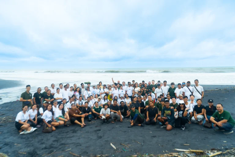 Volunteers and Ciputra Beach Resort team collaborating with Seven Clean Seas for Bali Beach Clean Up at Batu Tampih Beach Tabanan to remove plastic waste.